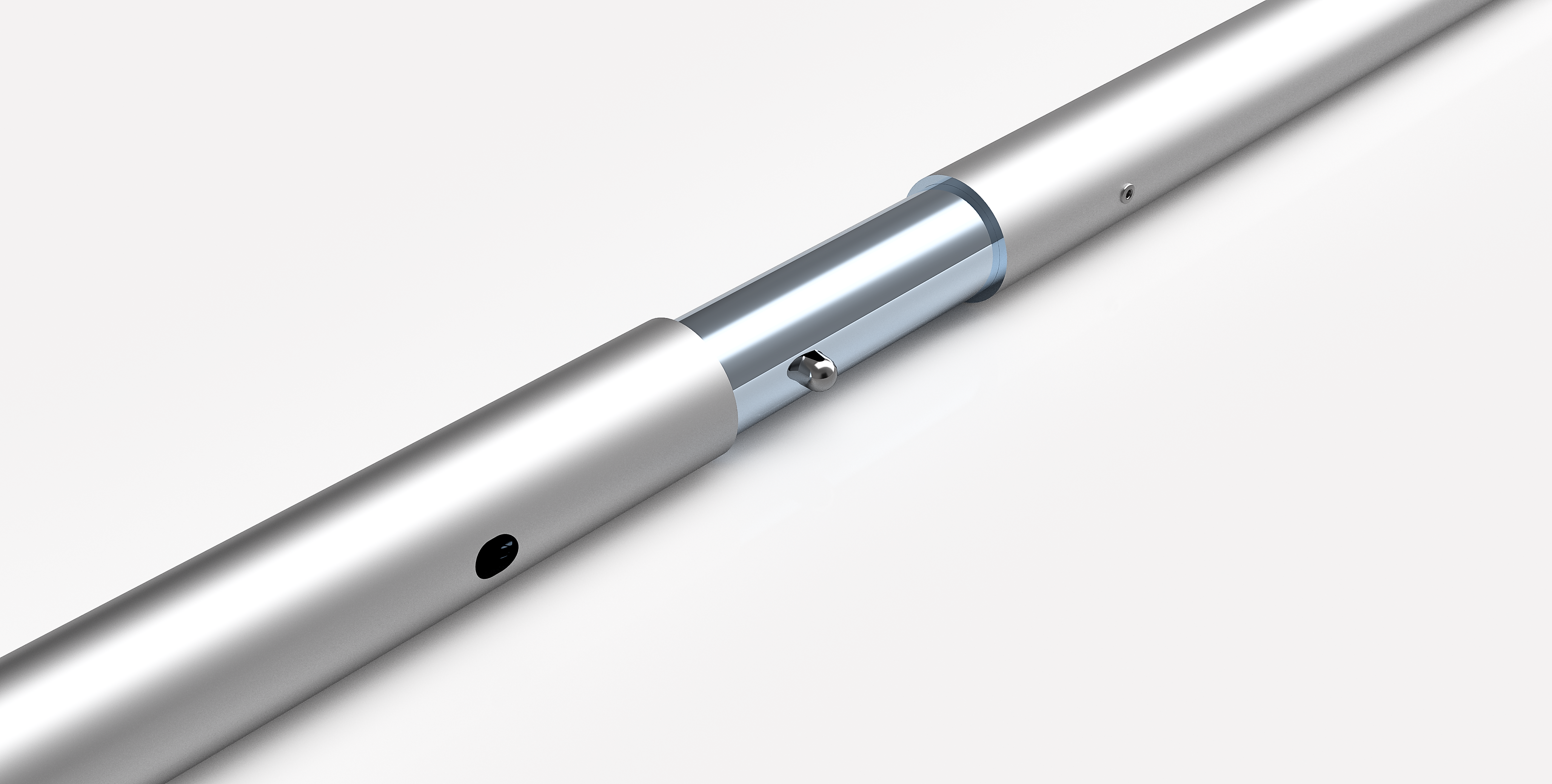 Close-up of a metallic cylindrical object with a silver finish on a white background