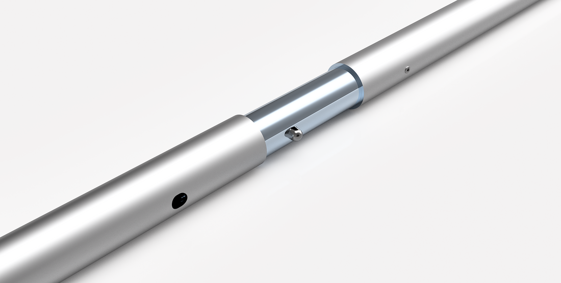 Close-up of a metallic cylindrical object with a silver finish on a white background
